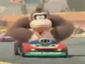 Donkey Kong driving, he looks both old school Donkey Kong Arcade, and new.